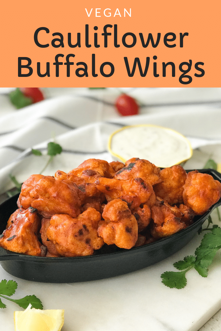 A plate of Cauliflower Buffalo wing on the table along with ranch