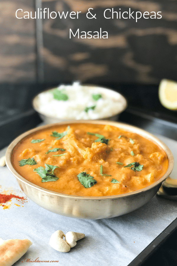 A bowl of food on a table, with Cauliflower and Masala