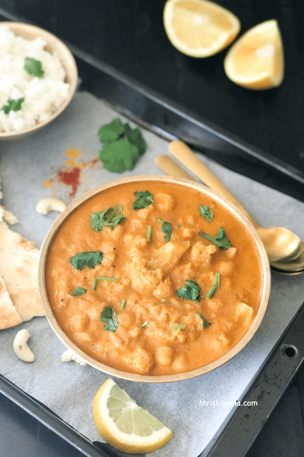 A pan of food on a table, with Cauliflower and Curry