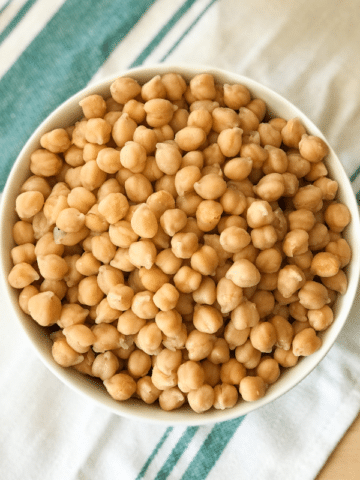 A bowl of food on a plate, with Chickpea