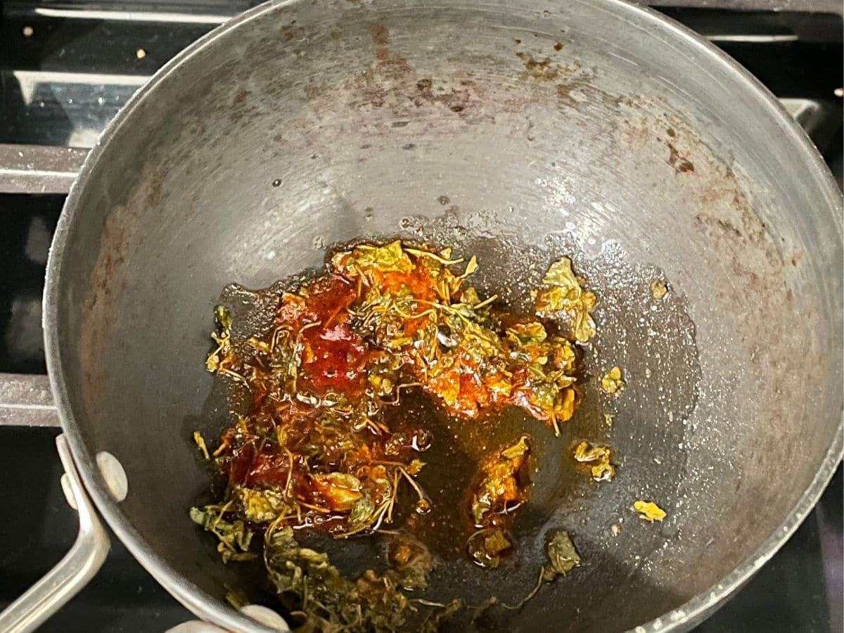 A small pan is with tempering for palak dal