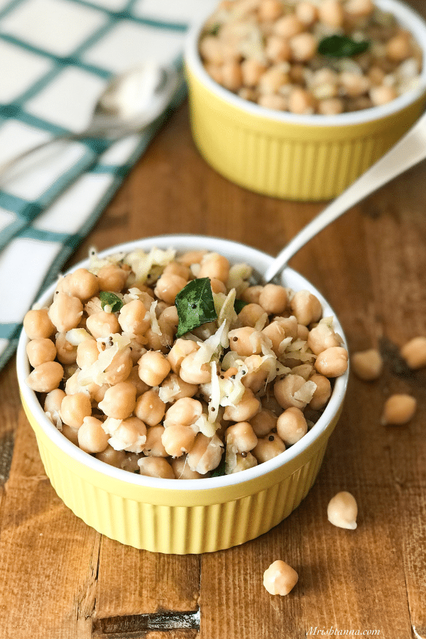 A bowl filled with chickpeas and grated raw mango