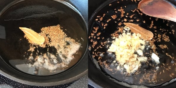 A pan placed on the stovetop with oil and cumin