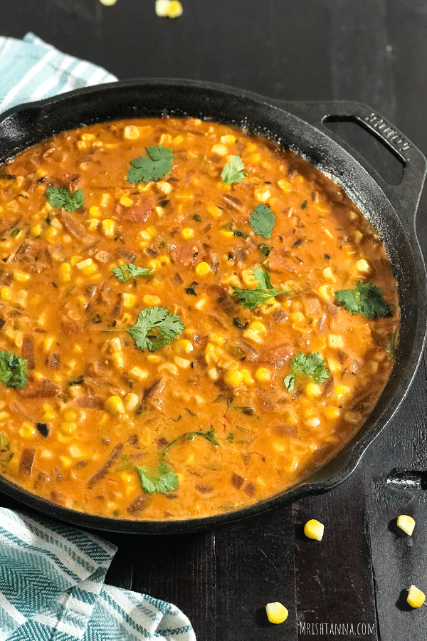 A dish is filled with food, with Curry and Coconut milk