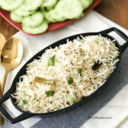 A plate of food on a table, with Rice and Cumin