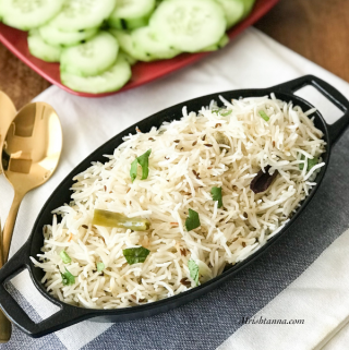 A plate of food on a table, with Rice and Cumin