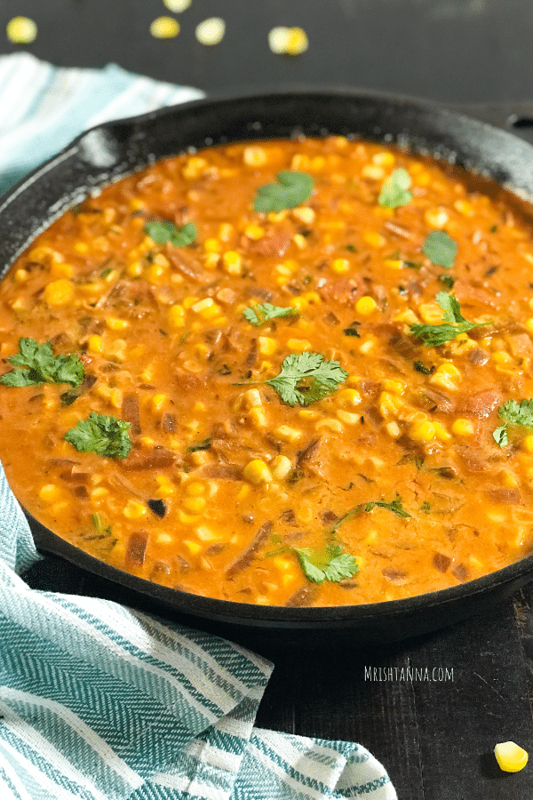 A pan of food, with sweet corn Curry and Spice