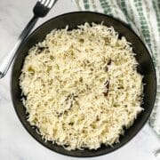 A plate of instant pot jeera rice is on the table.