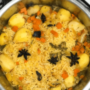 A pan filled with food, with Biryani
