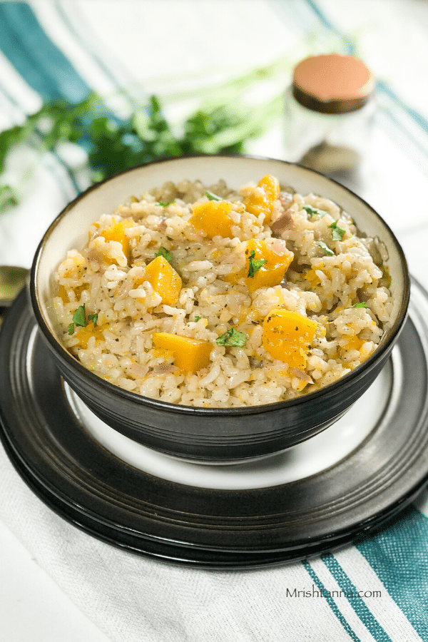 A bowl of risotto on the flat surface 