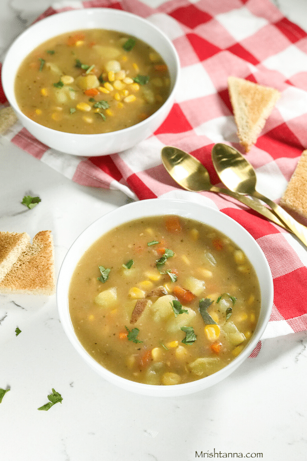 A bowl of soup on a table, with Chowder and Potato