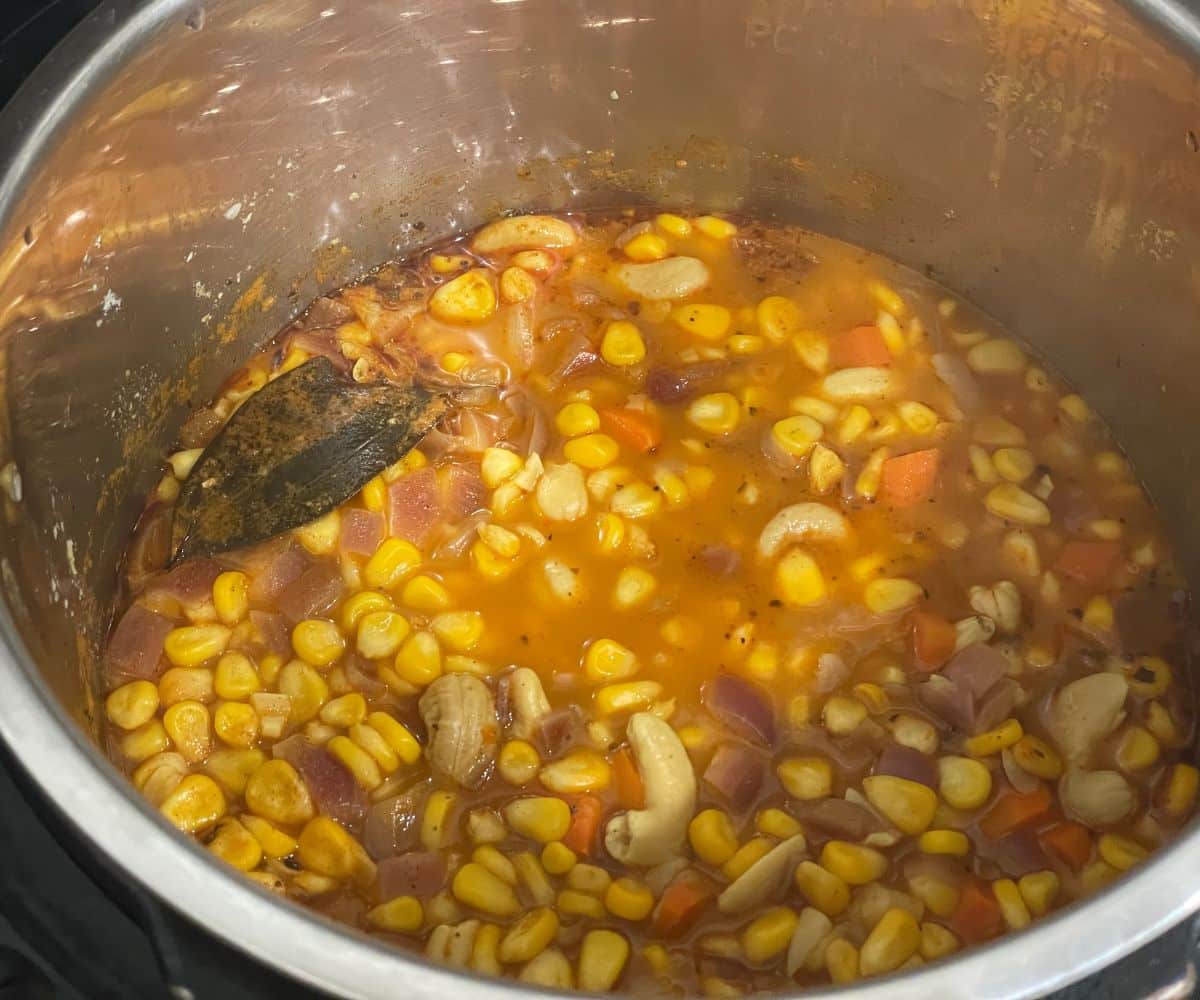 Cooked vegan corn chowder is in the pot.