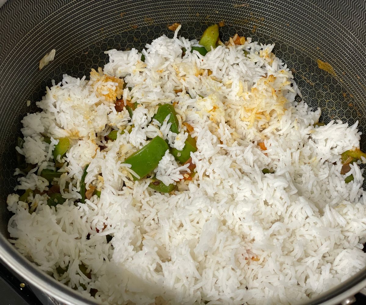 A pan is with capsicum rice. 
