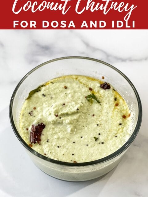 A bowl of coconut chutney is placed on the table.