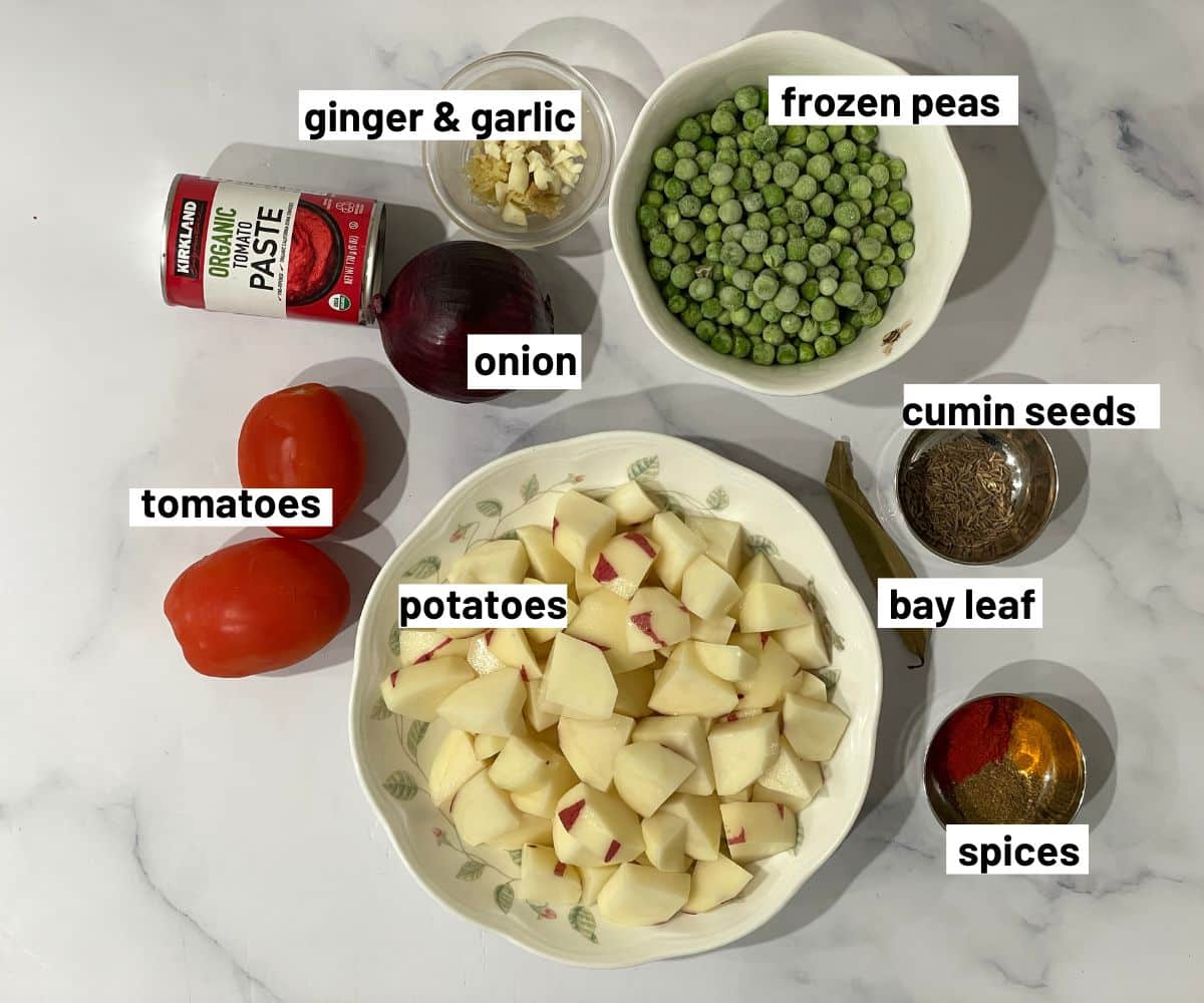 Instant pot Aloo matar ingredients are on the table.