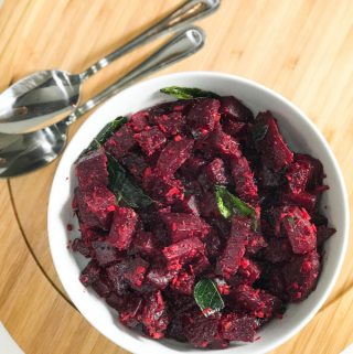 A bowl of food on a plate, with Beetroot