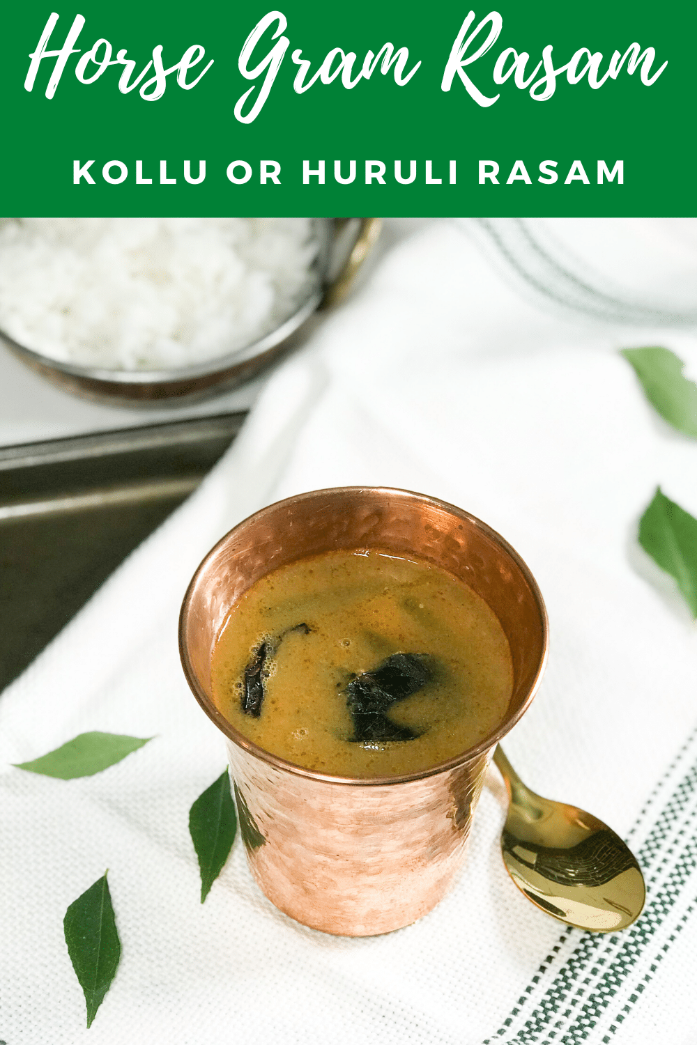 A cup of rasam on a table