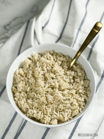 A bowl of rice on a table, with Basmati and Brown rice