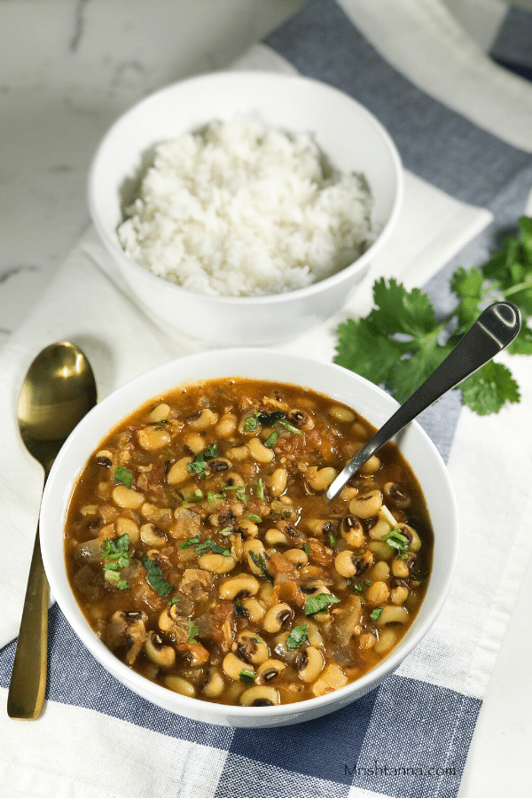 A bowl of curry and rice on a table