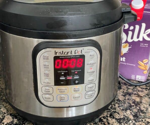 An instant pot showing cooking time for kheer.