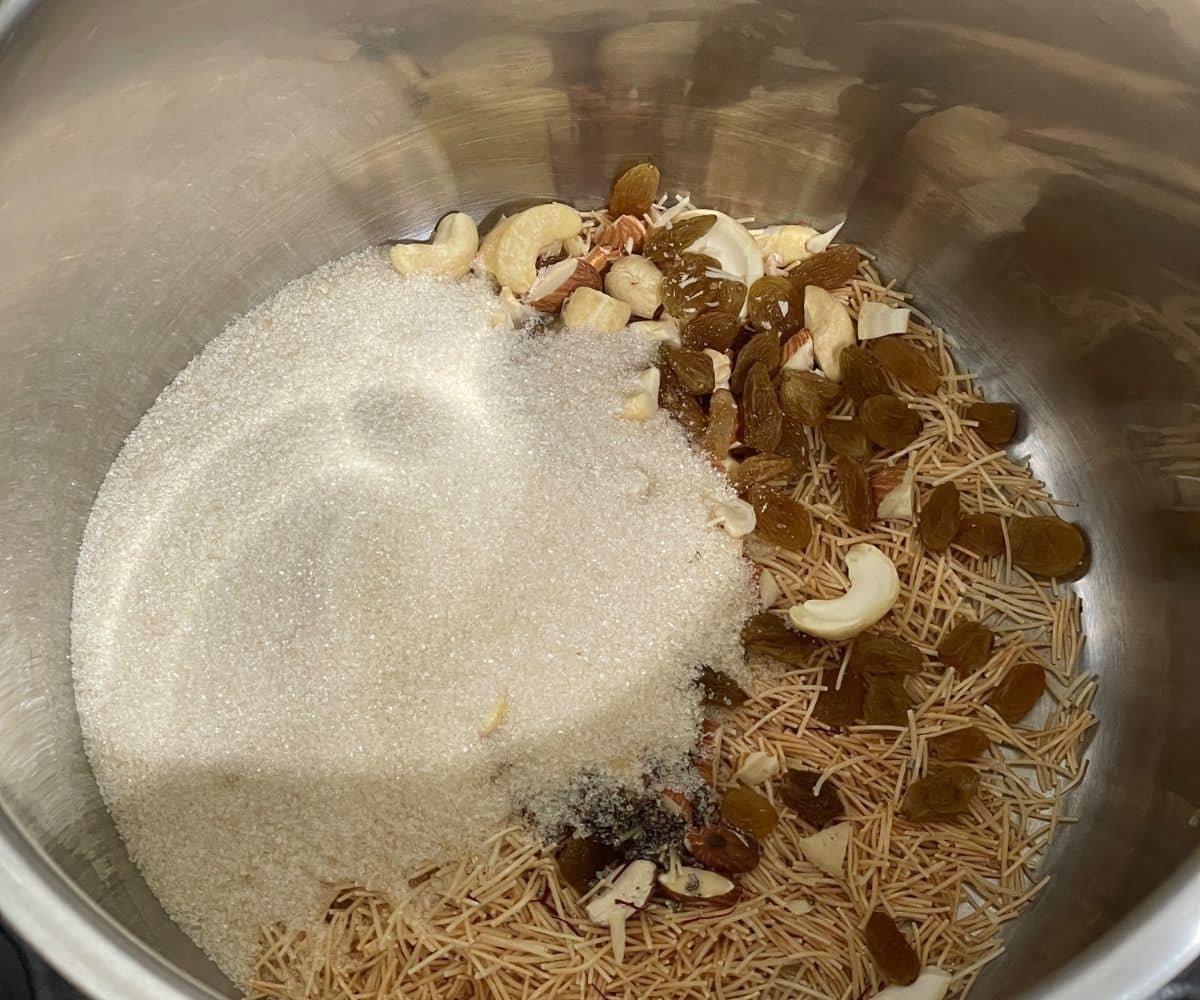 A pot is with semiya payasam ingredients.