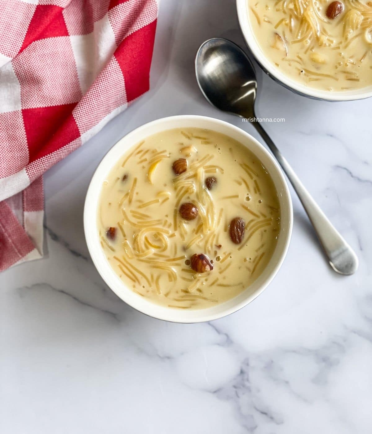 A bowl of semiya payasam is on the surface.