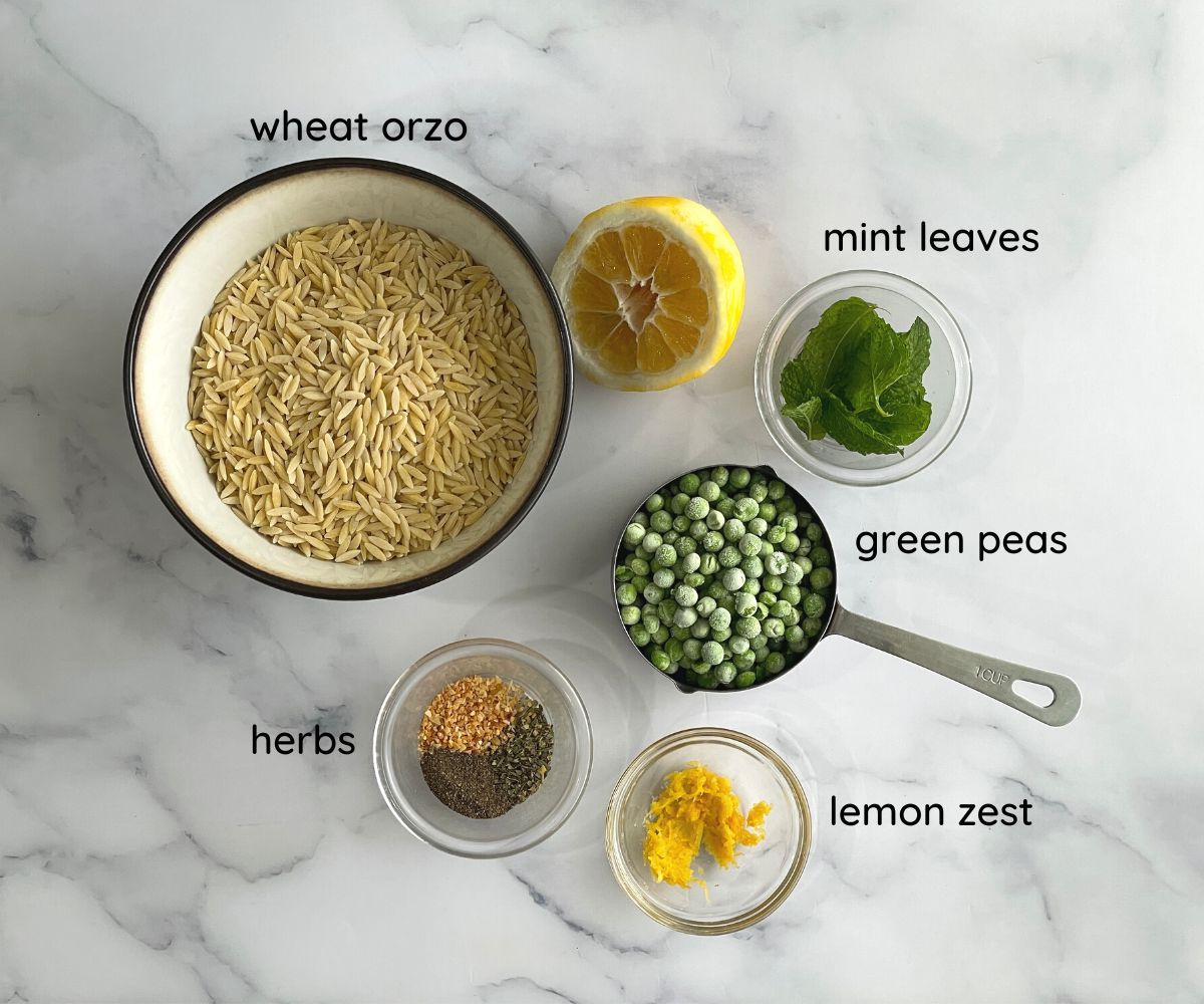 A surface is with lemon orzo ingredients.