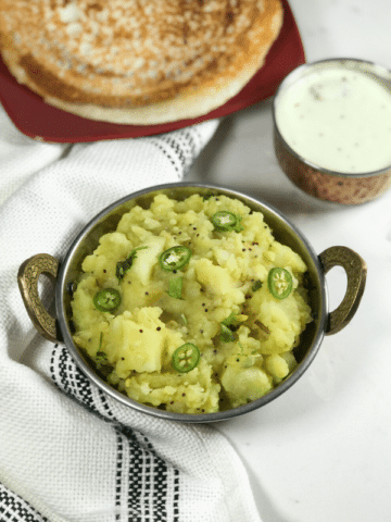 A bowl of potato curry on the table