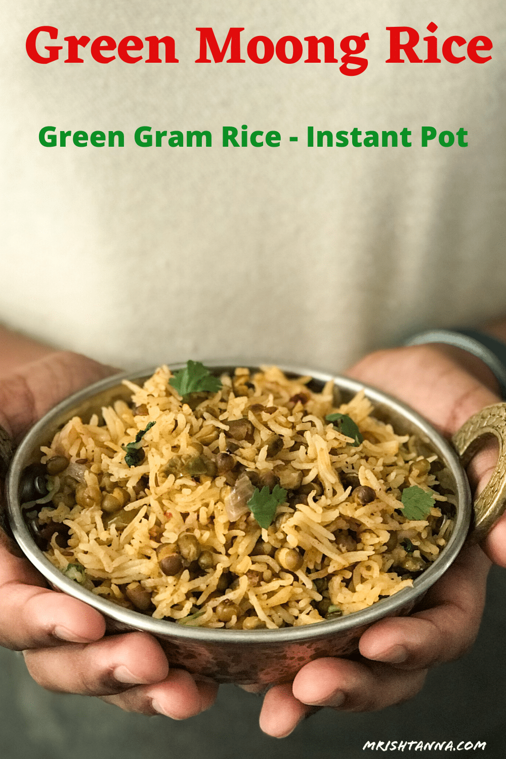 A person holding a bowl of green gram rice