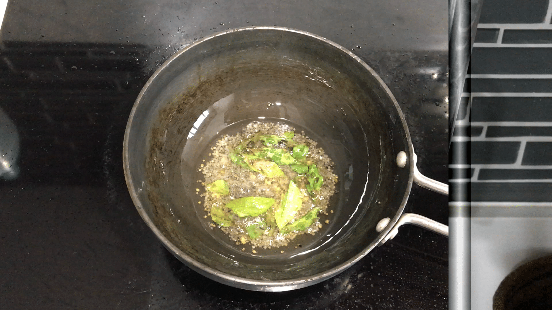 A small pan on the stovetop with spices
