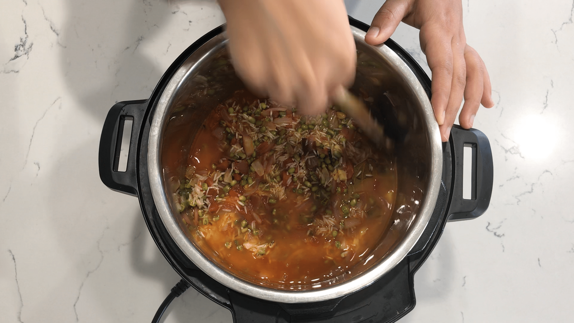 Instant Pot filled with spices, rice, and with dal