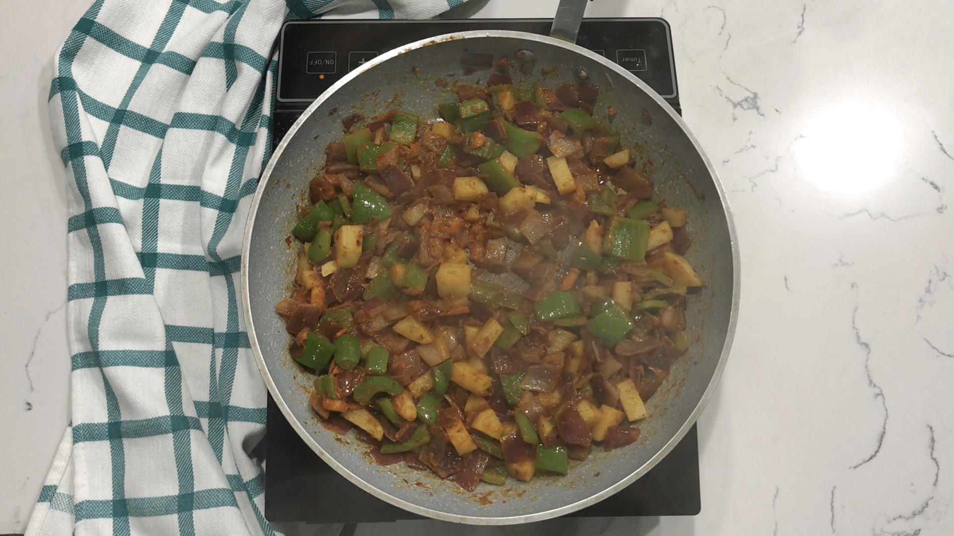 A bowl of food, with Curry and Potato