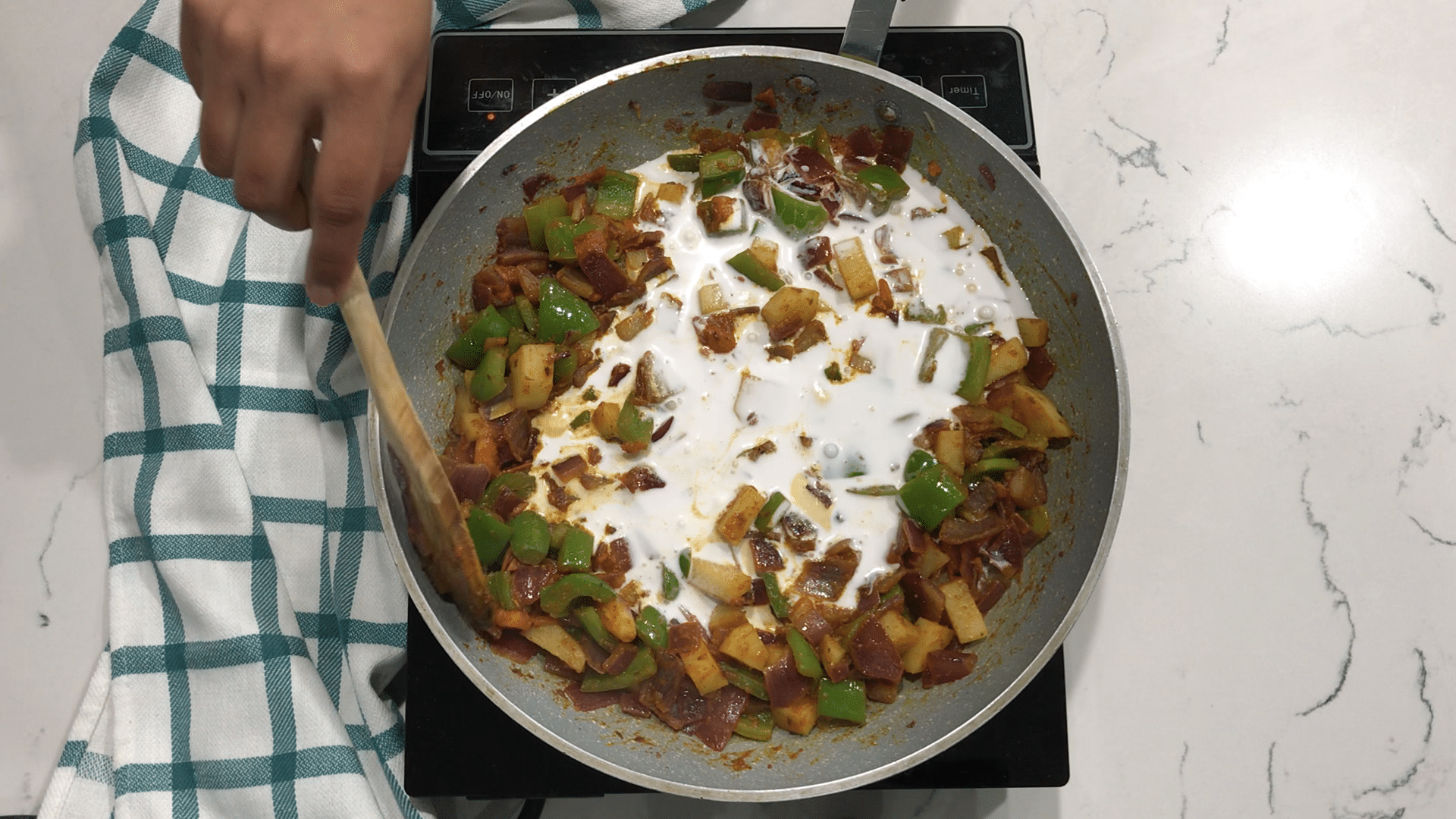 A bowl of food, with Curry and Coconut milk