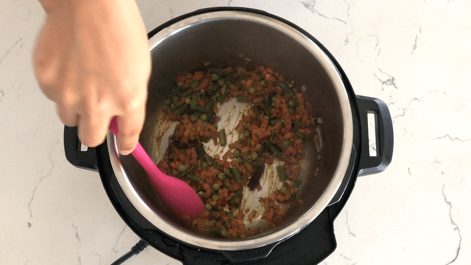 A person holding a bowl of food