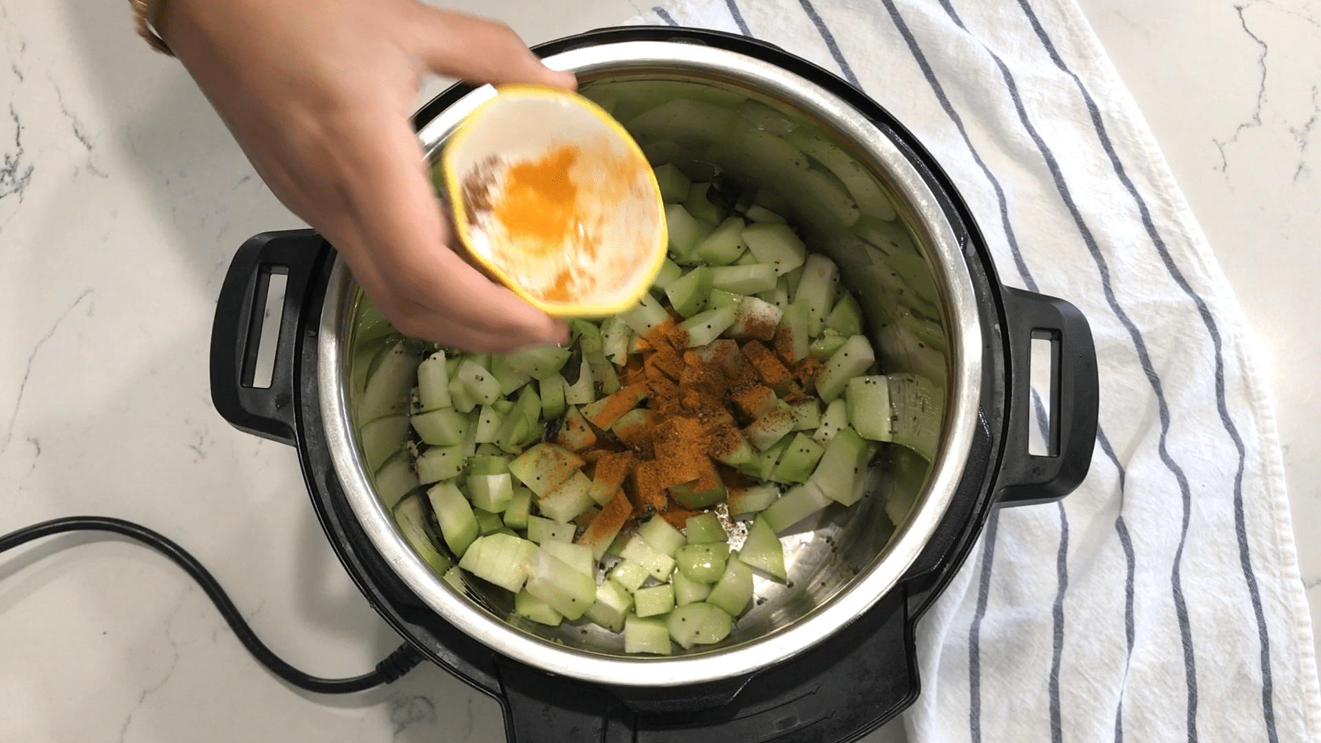 A bowl of food, with Dal and Chayote