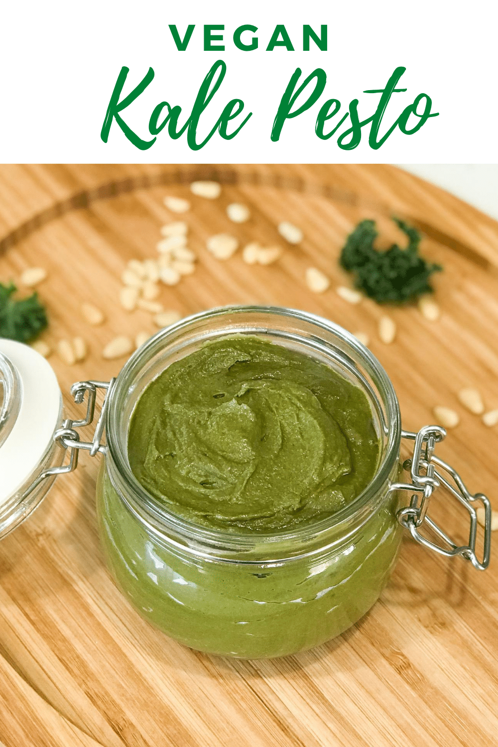 vegan Pesto Sauce is in the glass jar and placed on the wooden table