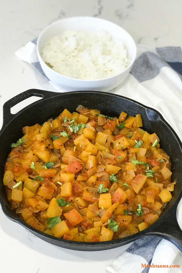 A bowl of food with rice and vegetables, with Curry and Watermelon