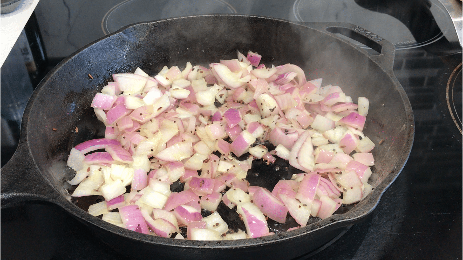 A pan filled with food, with Curry and Watermelon