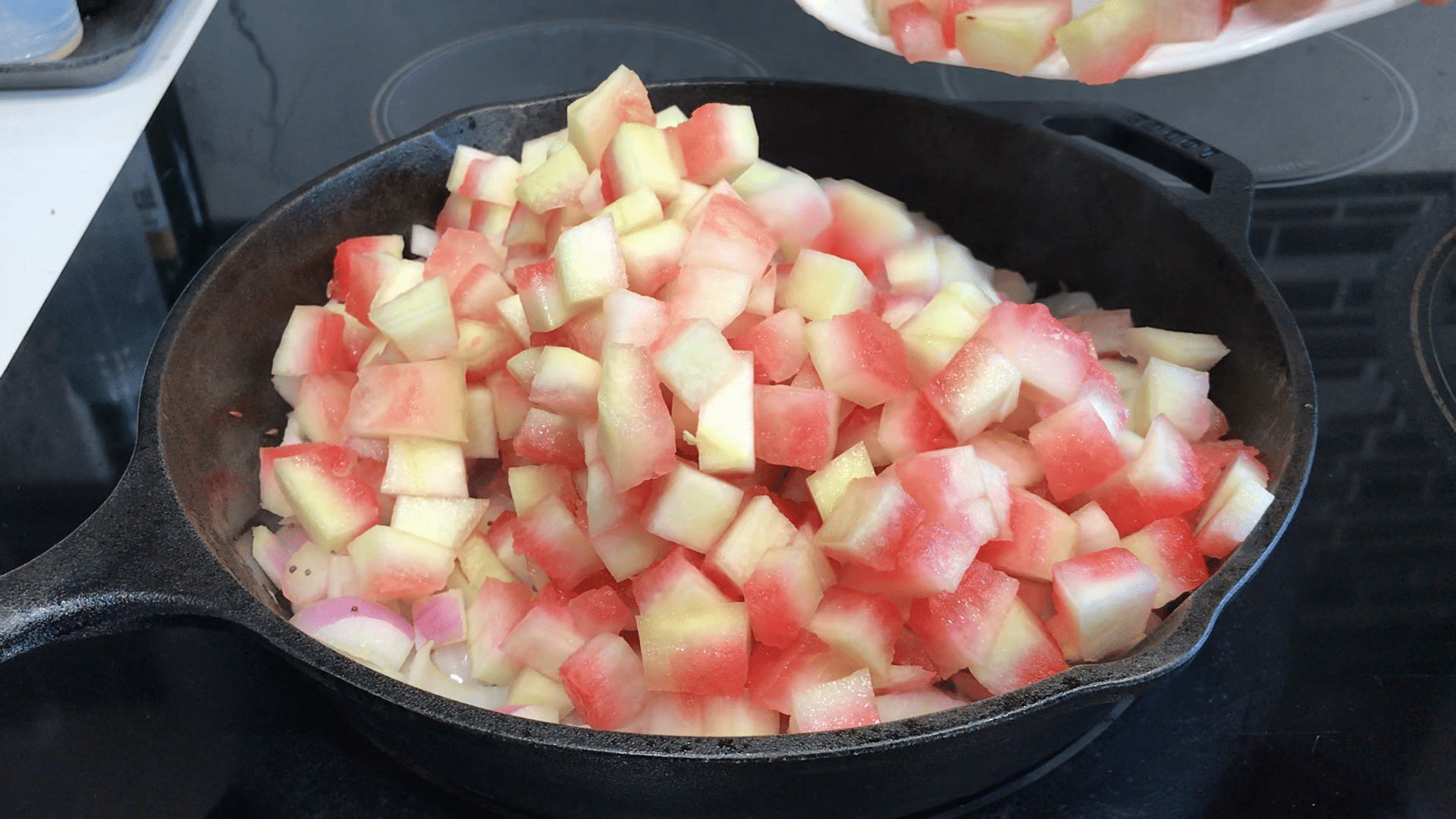 A pan filled with food, with Curry and Melon