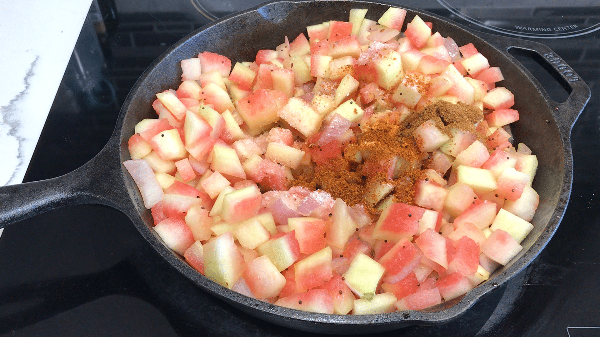 A pan filled with food, with Curry and Watermelon