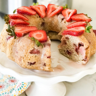 A piece of cake on a plate, with Strawberry cake