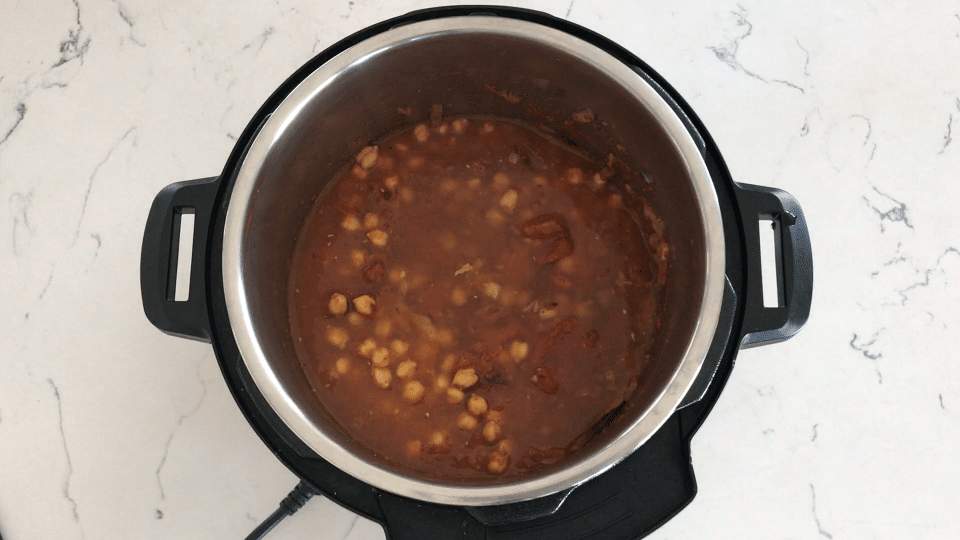 A bowl of soup, with Chana masala and Curry