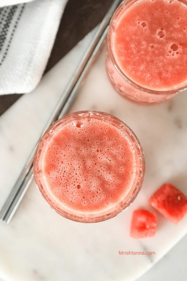 A glass with Smoothie and Watermelon