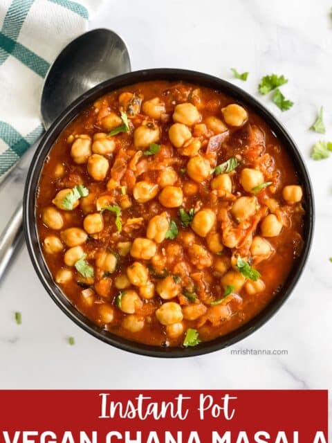 A bowl is filled with vegan Chana Masala curry.