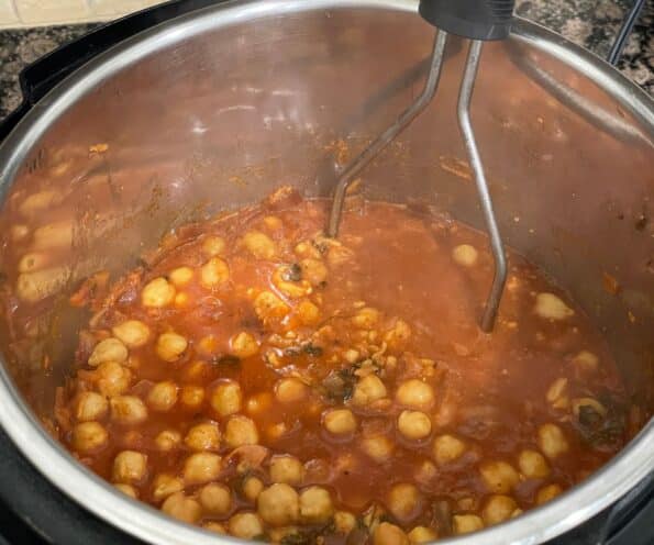 An Instant pot is with vegan chana masala.