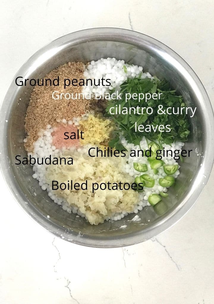 Sabudana, potatoes and other ingredients are placed in a big bowl