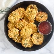 A plate of air fryer sabudana vada is on the table.