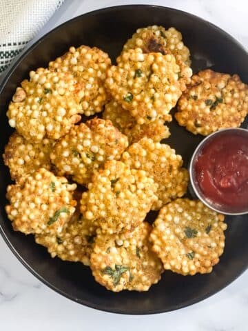A plate of air fryer sabudana vada is on the table.