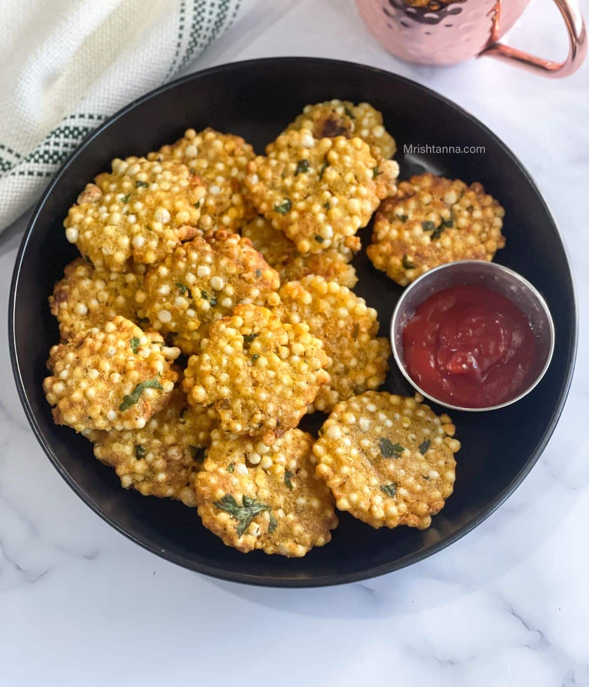 The plate is filled with air fried sabudana vada.