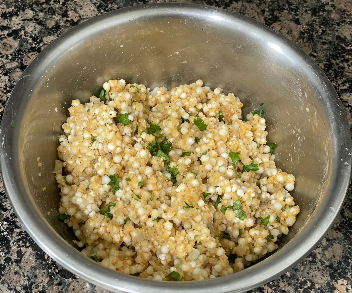 A bowl of sabudana vada mixture is on the counter top.